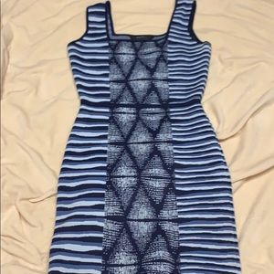 Turn heads in this blue multi patterned dress!